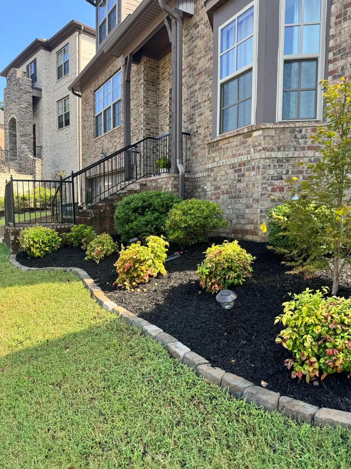 Front foundation bed finished in dark mulch