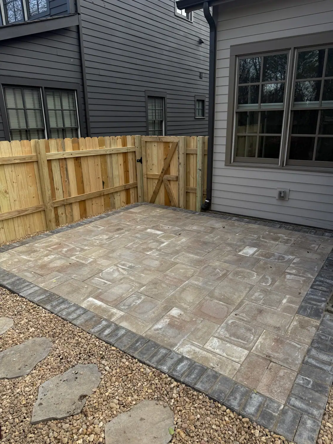 Paver patio with a contrasting soldier-course border