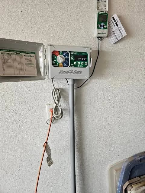 Smart sprinkler controller with wireless module mounted in a garage